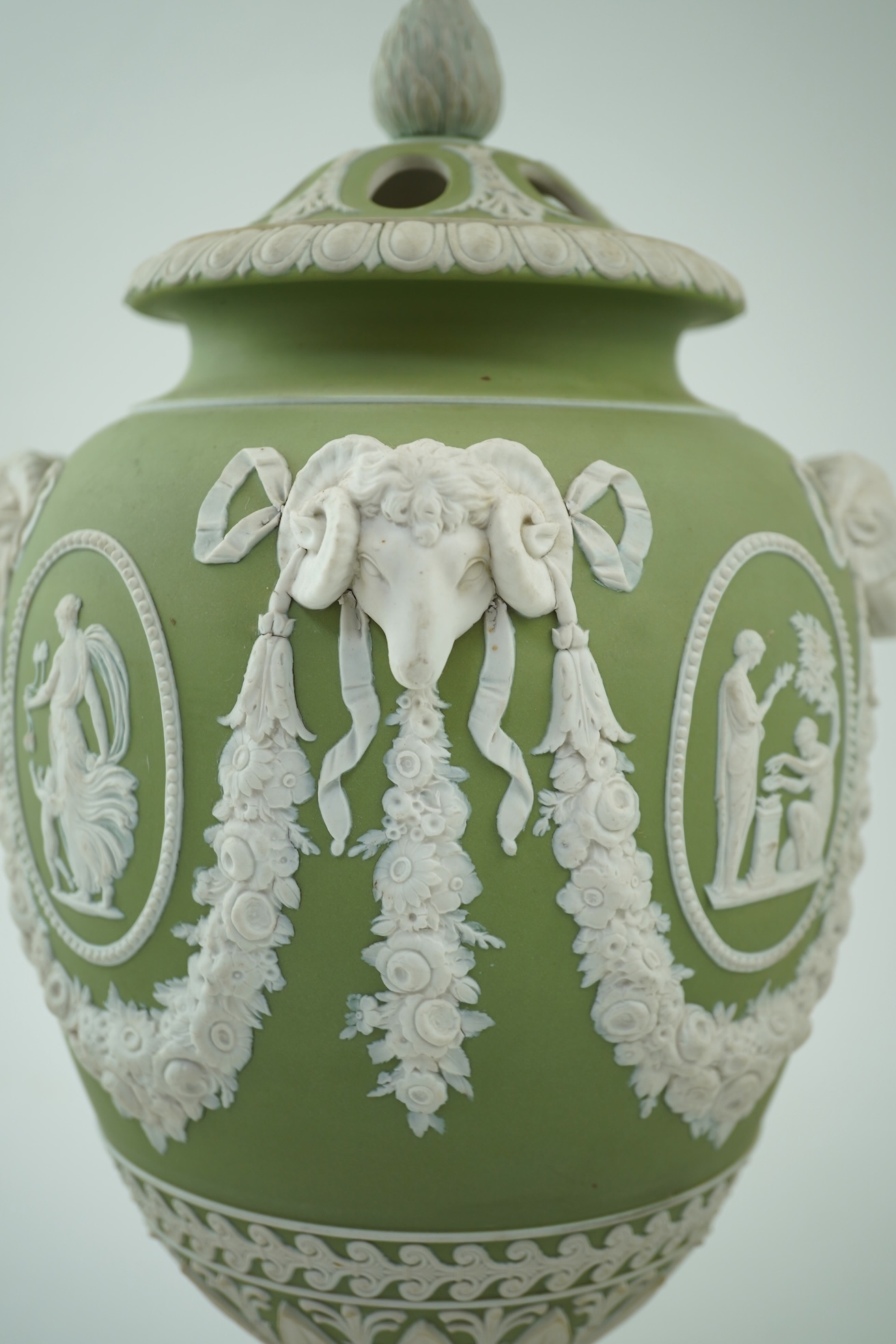 A Wedgwood green jasperware covered pot pourri urn, early 19th century